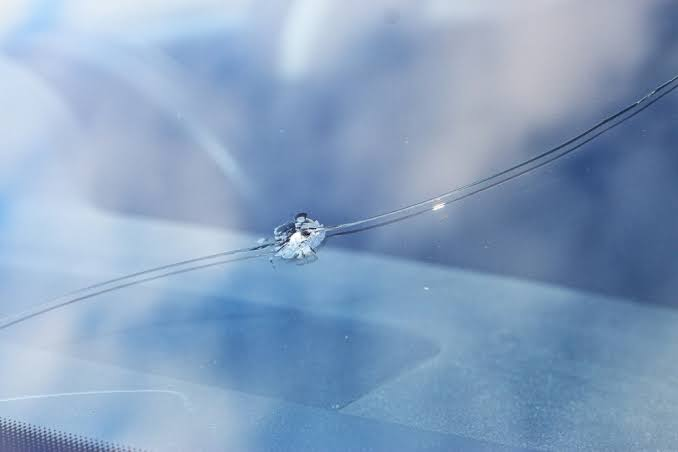 Close-up of a stone chip on a car windscreen before repair by Island Windscreens
